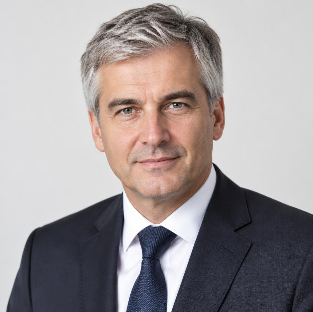 Studio portrait of a middle aged man in a suit